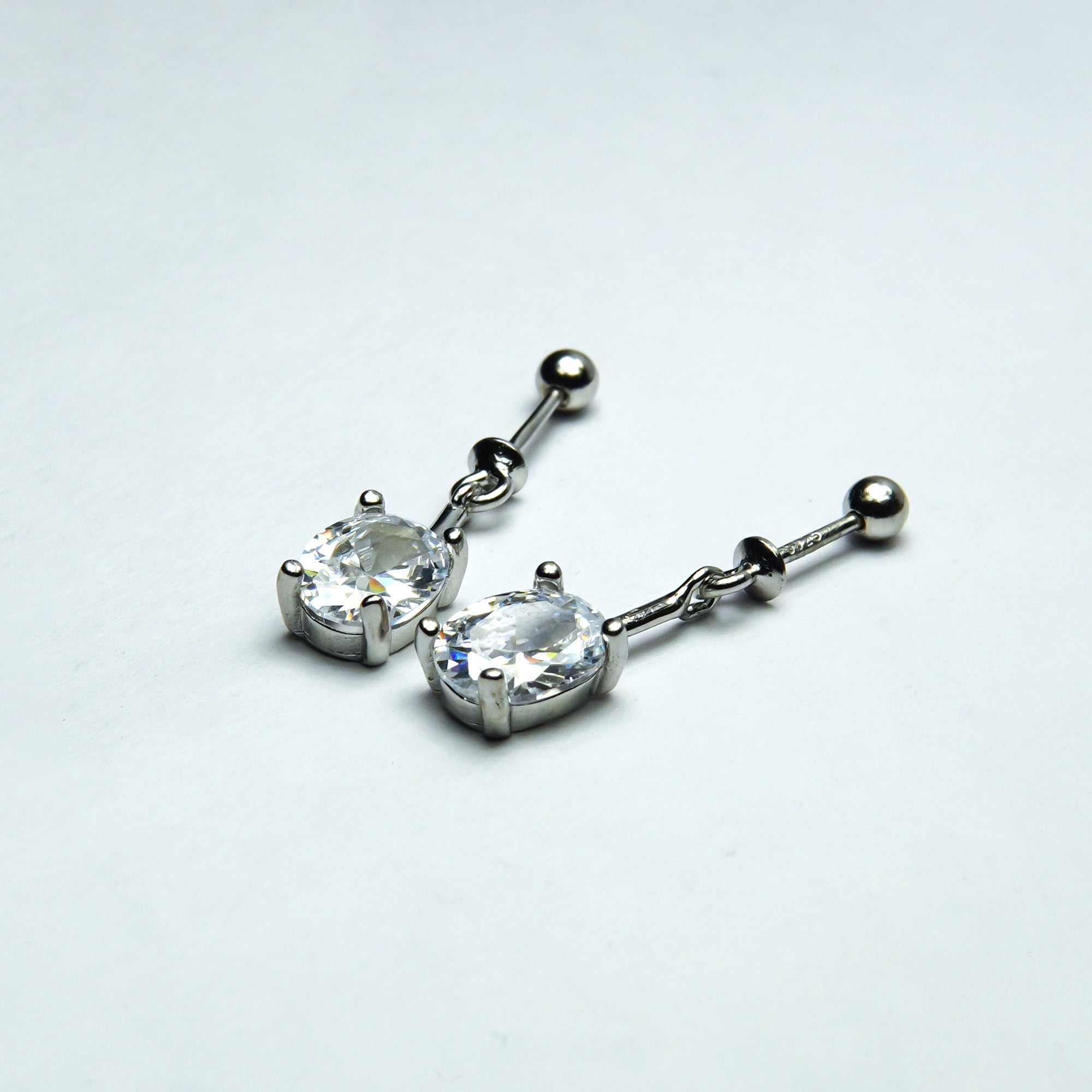 Radiant Silver Solitaire Linear Dangler Earrings