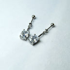 Radiant Silver Solitaire Linear Dangler Earrings