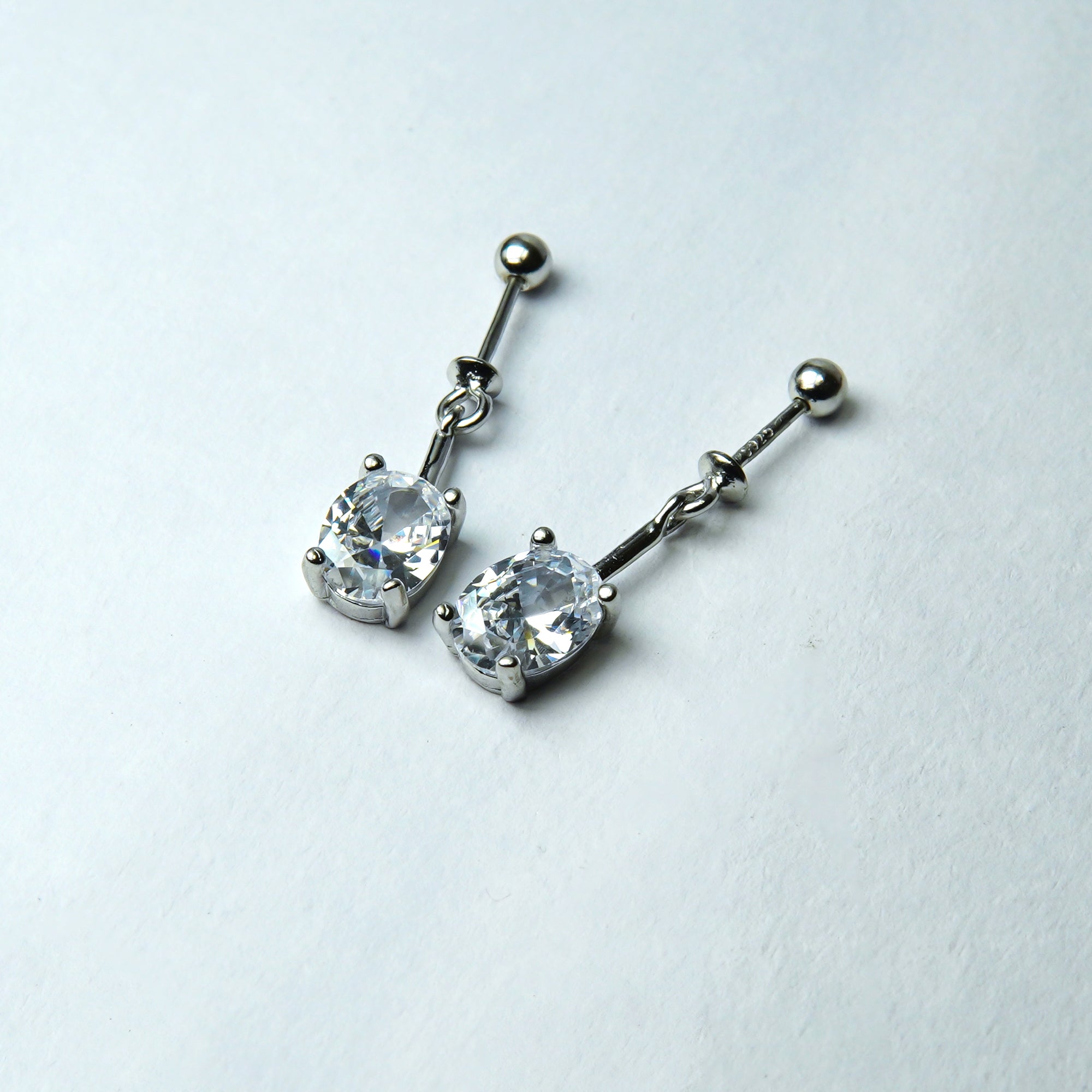 Radiant Silver Solitaire Linear Dangler Earrings